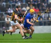 10 March 2024; Mark Rogers of Clare is tackled by Darragh Corcoran, left, and Mikey Butler of Kilkenny during the Allianz Hurling League Division 1 Group A match between Clare and Kilkenny at Cusack Park in Ennis, Clare. Photo by Ray McManus/Sportsfile