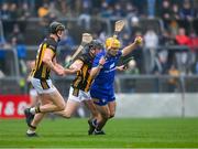 10 March 2024; Mark Rogers of Clare is tackled by Darragh Corcoran, left, and Mikey Butler of Kilkenny during the Allianz Hurling League Division 1 Group A match between Clare and Kilkenny at Cusack Park in Ennis, Clare. Photo by Ray McManus/Sportsfile