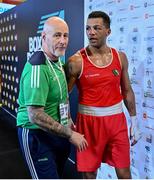 10 March 2024; Kelyn Cassidy of Ireland, right, celebrates with Ireland coach Damian Kennedy after winning their Men's 80kg Round of 16 bout against Rafayel Hovhannisyan of Armenia day eight at the Paris 2024 Olympic Boxing Qualification Tournament at E-Work Arena in Busto Arsizio, Italy. Photo by Ben McShane/Sportsfile