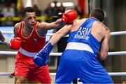 10 March 2024; Kelyn Cassidy of Ireland, left, in action against Rafayel Hovhannisyan of Armenia during their Men's 80kg Round of 16 bout during day eight at the Paris 2024 Olympic Boxing Qualification Tournament at E-Work Arena in Busto Arsizio, Italy. Photo by Ben McShane/Sportsfile