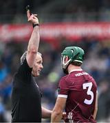 10 March 2024; Referee Johnny Murphy shows the black card to Fintan Burke of Galway during the Allianz Hurling League Division 1 Group B match between Galway v Dublin at Pearse Stadium in Galway. Photo by Piaras Ó Mídheach/Sportsfile