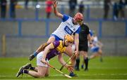 10 March 2024; Simon Donohoe of Wexford in action against Calum Lyons of Waterford during the Allianz Hurling League Division 1 Group A match between Waterford and Wexford at Walsh Park in Waterford. Photo by Seb Daly/Sportsfile