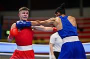 10 March 2024; Owain Harris-Allan of Great Britain, left, in action against Lucas Alexander Fernandez Garcia of Uruguay during their Men's 57kg Round of 16 bout during day eight at the Paris 2024 Olympic Boxing Qualification Tournament at E-Work Arena in Busto Arsizio, Italy. Photo by Ben McShane/Sportsfile