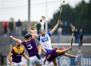 10 March 2024; Jack Prendergast of Waterford in action against Wexford players Conor Foley, 3, and Conor Hearne, right, during the Allianz Hurling League Division 1 Group A match between Waterford and Wexford at Walsh Park in Waterford. Photo by Seb Daly/Sportsfile