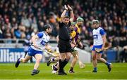 10 March 2024; Referee Colm Lyons attempts to keep out of the way as James Barron of Waterford escapes from Wexford's Kevin Foley during the Allianz Hurling League Division 1 Group A match between Waterford and Wexford at Walsh Park in Waterford. Photo by Seb Daly/Sportsfile