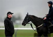 11 March 2024; Trainer Gordon Elliott looks on at Delta Work with Danny Gilligan on the gallops ahead of the Cheltenham Racing Festival at Prestbury Park in Cheltenham, England. Photo by David Fitzgerald/Sportsfile