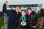 9 March 2024; Ethan Bramhill of Greystones CC, Wicklow, celebrates with his parents Nick and Carita after finishing second the minor boys 2500m during the 123.ie All Ireland Schools Cross Country Championships at Tymon Park in Tallaght, Dublin. Photo by Sam Barnes/Sportsfile
