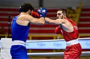 11 March 2024; Mateusz Bereznicki of Poland, right, in action against Patrick Brown of Great Britain during their Men's 92kg Quarterfinals bout during day nine at the Paris 2024 Olympic Boxing Qualification Tournament at E-Work Arena in Busto Arsizio, Italy. Photo by Ben McShane/Sportsfile