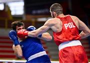 11 March 2024; Mateusz Bereznicki of Poland, right, in action against Patrick Brown of Great Britain during their Men's 92kg Quarterfinals bout during day nine at the Paris 2024 Olympic Boxing Qualification Tournament at E-Work Arena in Busto Arsizio, Italy. Photo by Ben McShane/Sportsfile