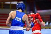 11 March 2024; Grainne Walsh of Ireland, right, in action against Aneta Rygielska of Poland during their Women's 66kg Quarterfinals bout during day nine at the Paris 2024 Olympic Boxing Qualification Tournament at E-Work Arena in Busto Arsizio, Italy. Photo by Ben McShane/Sportsfile