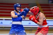 11 March 2024; Grainne Walsh of Ireland, right, in action against Aneta Rygielska of Poland during their Women's 66kg Quarterfinals bout during day nine at the Paris 2024 Olympic Boxing Qualification Tournament at E-Work Arena in Busto Arsizio, Italy. Photo by Ben McShane/Sportsfile