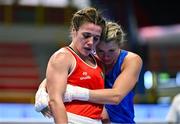 11 March 2024; Grainne Walsh of Ireland, left, is consoled by Aneta Rygielska of Poland after her defeat in thier Women's 66kg Quarterfinals bout during day nine at the Paris 2024 Olympic Boxing Qualification Tournament at E-Work Arena in Busto Arsizio, Italy. Photo by Ben McShane/Sportsfile