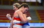 11 March 2024; Grainne Walsh of Ireland, left, is consoled by Aneta Rygielska of Poland after her defeat in thier Women's 66kg Quarterfinals bout during day nine at the Paris 2024 Olympic Boxing Qualification Tournament at E-Work Arena in Busto Arsizio, Italy. Photo by Ben McShane/Sportsfile