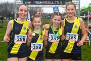 9 March 2024; The SH Westport team, Mayo, from left, Erin Walsh, Freya Renton, Holly Renton and Eimear Jennings after winning the junior girls 2500m team event during the 123.ie All Ireland Schools Cross Country Championships at Tymon Park in Tallaght, Dublin. Photo by Sam Barnes/Sportsfile