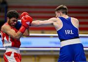 11 March 2024; Jude Gallagher of Ireland, right, in action against Shukur Ovezov of Turkmenistan during their Men's 57kg Quarterfinals bout during day nine at the Paris 2024 Olympic Boxing Qualification Tournament at E-Work Arena in Busto Arsizio, Italy. Photo by Ben McShane/Sportsfile