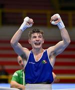 11 March 2024; Jude Gallagher of Ireland, celebrates after qualifying for the Olympics after winning their Men's 57kg Quarterfinals bout against Shukur Ovezov of Turkmenistan during day nine at the Paris 2024 Olympic Boxing Qualification Tournament at E-Work Arena in Busto Arsizio, Italy. Photo by Ben McShane/Sportsfile