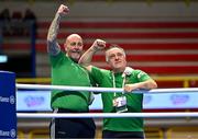 11 March 2024; Ireland coaches Zaur Antia, right, and Damian Kennedy, celebrate after Jude Gallagher of Ireland qualified for the Olympics after winning their Men's 57kg Quarterfinals bout against Shukur Ovezov of Turkmenistan during day nine at the Paris 2024 Olympic Boxing Qualification Tournament at E-Work Arena in Busto Arsizio, Italy. Photo by Ben McShane/Sportsfile