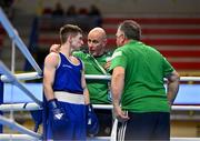 11 March 2024; Jude Gallagher of Ireland, in his Men's 57kg Quarterfinals bout against Shukur Ovezov of Turkmenistan, with Ireland coach Damian Kennedy, centre, during day nine at the Paris 2024 Olympic Boxing Qualification Tournament at E-Work Arena in Busto Arsizio, Italy. Photo by Ben McShane/Sportsfile