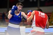 11 March 2024; Jude Gallagher of Ireland, left, in action against Shukur Ovezov of Turkmenistan during their Men's 57kg Quarterfinals bout during day nine at the Paris 2024 Olympic Boxing Qualification Tournament at E-Work Arena in Busto Arsizio, Italy. Photo by Ben McShane/Sportsfile