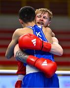 11 March 2024; Kieran MacDonald of Great Britain, right, and Saken Bibossinov of Kazakhstan embrace after their Men's 51kg Quarterfinals bout during their Men's 57kg Quarterfinals bout during day nine at the Paris 2024 Olympic Boxing Qualification Tournament at E-Work Arena in Busto Arsizio, Italy. Photo by Ben McShane/Sportsfile