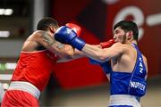 11 March 2024; Kelyn Cassidy of Ireland, left, in action against Nurbek Oralbay of Kazakhstan during their Men's 80kg Quarterfinals bout during day nine at the Paris 2024 Olympic Boxing Qualification Tournament at E-Work Arena in Busto Arsizio, Italy. Photo by Ben McShane/Sportsfile