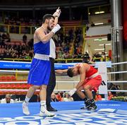 11 March 2024; Nurbek Oralbay of Kazakhstan, left, is declared victorius against Kelyn Cassidy of Ireland in their Men's 80kg Quarterfinals bout against Nurbek Oralbay of Kazakhstan during day nine at the Paris 2024 Olympic Boxing Qualification Tournament at E-Work Arena in Busto Arsizio, Italy. Photo by Ben McShane/Sportsfile
