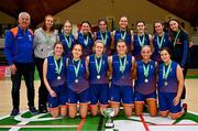 12 March 2024; The MICL team pose for a photograph with the cup after their side's victory in the Basketball Ireland College Division 3 Women’s finals match between Technological University of the Shannon, Midlands and Mary Immaculate College Limerick at National Basketball Arena Tallaght. Photo by Tyler Miller/Sportsfile