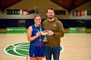 12 March 2024; Kate Connaughton of MICL is presnted the cup by NBCC chairperson Darren McGovern after the Basketball Ireland College Division 3 Women’s finals match between Technological University of the Shannon, Midlands and Mary Immaculate College Limerick at National Basketball Arena Tallaght. Photo by Tyler Miller/Sportsfile