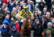 12 March 2024; Jockey Paul Townend celebrates with trainer Willie Mullins after winning the Unibet Champion Hurdle Challenge Trophy on State Man during day one of the Cheltenham Racing Festival at Prestbury Park in Cheltenham, England. Photo by David Fitzgerald/Sportsfile