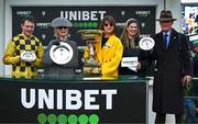 12 March 2024; Trainer Willie Mullins, right, and jockey Paul Townened celebrate with winning connections after victory in the Unibet Champion Hurdle Challenge Trophy with State Man on day one of the Cheltenham Racing Festival at Prestbury Park in Cheltenham, England. Photo by Harry Murphy/Sportsfile