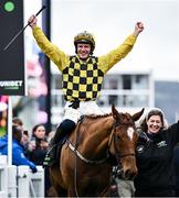 12 March 2024; Jockey Paul Townend celebrates aboard State Man with groom Rachel Robins after winning the Unibet Champion Hurdle Challenge Trophy on day one of the Cheltenham Racing Festival at Prestbury Park in Cheltenham, England. Photo by Harry Murphy/Sportsfile