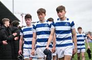 12 March 2024; Blackrock College players, from left, Patrick Agnew, George Eggers and Dan Noonan leave the field dejected after their side's defeat in the Bank of Ireland Schools Junior Cup semi-final match between Blackrock College and Terenure College at Energia Park in Dublin. Photo by Sam Barnes/Sportsfile