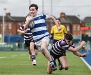 12 March 2024; John Clarke of Blackrock College avoids the tackle of Niall Fallon of Terenure College on his way to scoring his side's third try during the Bank of Ireland Schools Junior Cup semi-final match between Blackrock College and Terenure College at Energia Park in Dublin. Photo by Sam Barnes/Sportsfile