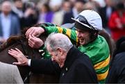12 March 2024; Jockey Derek O'Connor celebrates with owner JP McManus after winning the Maureen Mullins National Hunt Challenge Cup Amateur Jockeys' Novices' Chase on Corbetts Cross on day one of the Cheltenham Racing Festival at Prestbury Park in Cheltenham, England. Photo by Harry Murphy/Sportsfile