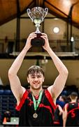 13 March 2024; Griffith College Dublin captain Jim Gormley lifts the trophy after his side's victory in the Basketball Ireland Men's Colleges Division 1 final match between TUS Midwest and Griffith College Dublin at National Basketball Arena in Tallaght, Dublin. Photo by Piaras Ó Mídheach/Sportsfile