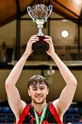 13 March 2024; Griffith College Dublin captain Jim Gormley lifts the trophy after his side's victory in the Basketball Ireland Men's Colleges Division 1 final match between TUS Midwest and Griffith College Dublin at National Basketball Arena in Tallaght, Dublin. Photo by Piaras Ó Mídheach/Sportsfile