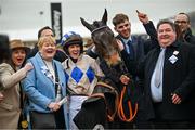 13 March 2024; Jockey Rachael Blackmore and trainer Henry De Bromhead celebrate with winning connections after victory in the Champion Chase with Captain Guinness on day two of the Cheltenham Racing Festival at Prestbury Park in Cheltenham, England. Photo by David Fitzgerald/Sportsfile