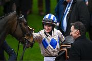 13 March 2024; Jockey Rachael Blackmore celebrates with trainer Henry De Bromhead and Captain Guinness after winning the Champion Chase on day two of the Cheltenham Racing Festival at Prestbury Park in Cheltenham, England. Photo by Harry Murphy/Sportsfile