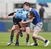13 March 2024; Joshua Divilly of St Michael’s College is tackled by Tom O’Keefe of St Mary’s College during the Bank of Ireland Schools Junior Cup semi-final match between St Michael's College and St Mary's College at Energia Park in Dublin. Photo by Daire Brennan/Sportsfile