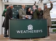 13 March 2024; Trainer Willie Mullins, third from right, celebrates with winning connections after sending out Jasmin De Vaux to win the Weatherbys Champion Bumper, his hundreth Cheltenham winner, on day two of the Cheltenham Racing Festival at Prestbury Park in Cheltenham, England. Photo by David Fitzgerald/Sportsfile