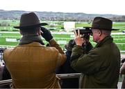 13 March 2024; Trainer Willie Mullins, right, watches the Weatherbys Champion Bumper, where he had his hundreth Cheltenham winner, on day two of the Cheltenham Racing Festival at Prestbury Park in Cheltenham, England. Photo by Harry Murphy/Sportsfile