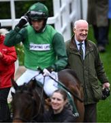 13 March 2024; Trainer Willie Mullins celebrates after his hundreth Cheltenham winner as jockey Patrick Mullins, aboard Jasmin De Vaux, is led into the parade ring after winning the Weatherbys Champion Bumper on day two of the Cheltenham Racing Festival at Prestbury Park in Cheltenham, England. Photo by David Fitzgerald/Sportsfile