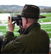 13 March 2024; Trainer Willie Mullins watches the Weatherbys Champion Bumper, where he had his hundreth Cheltenham winner, on day two of the Cheltenham Racing Festival at Prestbury Park in Cheltenham, England. Photo by Harry Murphy/Sportsfile