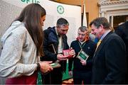 13 March 2024; Olympians and Olympic medallists, from left, Annalise Murphy, Kenneth Egan and Paddy Barnes, admire the medal of David Wilkins, right, at a reception in Trinity College to celebrate 100 years of Team Ireland’s participation at the Olympics, and to officially reveal the names of the athletes who have represented Ireland in the Olympic Games since Ireland first competed as a nation in Paris 1924. Photo by Brendan Moran/Sportsfile