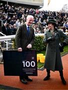 14 March 2024; Princess Anne, Princess Royal, speaks with trainer Willie Mullins, after he was presented with a framed print to mark his hundreth Cheltenham winner, on day three of the Cheltenham Racing Festival at Prestbury Park in Cheltenham, England. Photo by Harry Murphy/Sportsfile