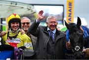 14 March 2024; Jockey Harry Cobden and joint owner Sir Alex Ferguson celebrate with Monmiral after victory in the Pertemps Handicap Hurdle on day three of the Cheltenham Racing Festival at Prestbury Park in Cheltenham, England. Photo by Harry Murphy/Sportsfile