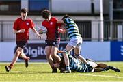 14 March 2024; Sam Cotter of CUS is tackled by Oscar He, bottom, and Luke Kelly of St Gerard's School during the Bank of Ireland Father Godfrey Cup final match between CUS and St Gerard's School at Energia Park in Dublin. Photo by Ben McShane/Sportsfile