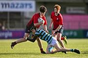 14 March 2024; Sam Cotter of CUS is tackled by Noah O'Neill of St Gerard's School during the Bank of Ireland Father Godfrey Cup final match between CUS and St Gerard's School at Energia Park in Dublin. Photo by Ben McShane/Sportsfile