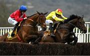 14 March 2024; Protektorat, with Harry Skelton up, right, jump the last alongside Envoi Allen, with Rachael Blackmore up, who finished second, on their way to winning the Ryanair Chase on day three of the Cheltenham Racing Festival at Prestbury Park in Cheltenham, England. Photo by Harry Murphy/Sportsfile