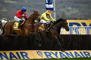 14 March 2024; Protektorat, with Harry Skelton up, right, jump the last alongside Envoi Allen, with Rachael Blackmore up, who finished second, on their way to winning the Ryanair Chase on day three of the Cheltenham Racing Festival at Prestbury Park in Cheltenham, England. Photo by Harry Murphy/Sportsfile
